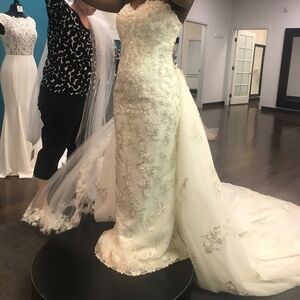 Beaded, lace, and sequin wedding dress with exquisite detachable train